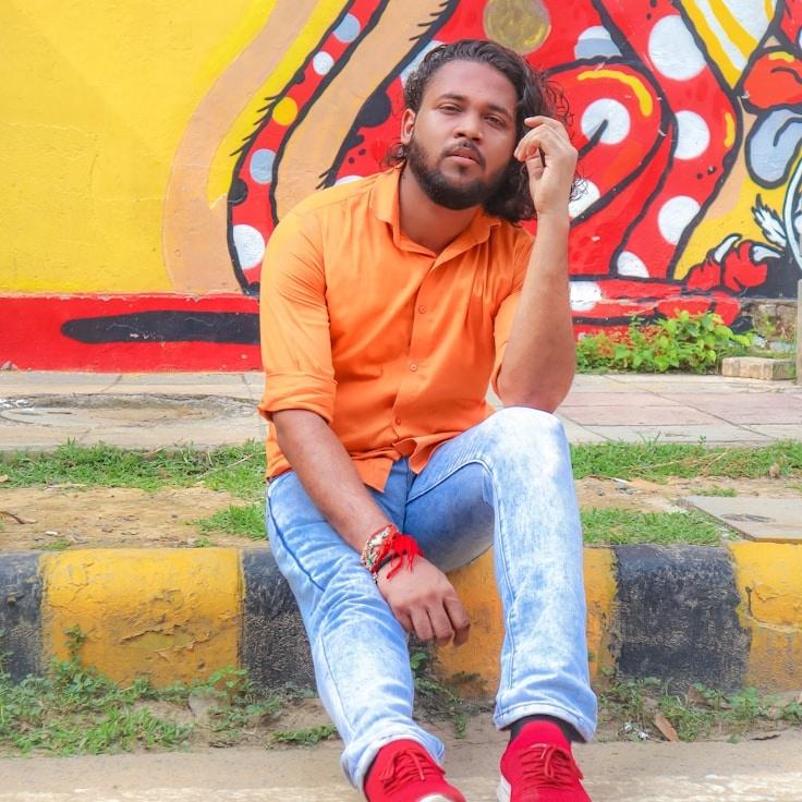 Kaveri Mehta, Lead Design Curator at GladeCoveHaven, reviewing corporate floral arrangements